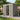 Gray metal garden shed with open front door showing storage interior