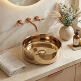 Round bronze countertop basin sink with central drain and overflow