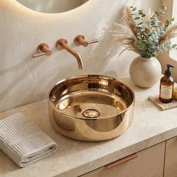 Round bronze countertop basin sink with central drain and overflow
