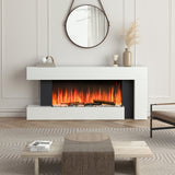 Freestanding electric fireplace with white mantel and dark sides, orange flame burning in insert.