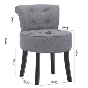 Grey upholstered vanity stool with black wooden legs and tufted back, round padded seat