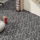Dark gray marble-look vinyl floor tiles with white veining along room corner