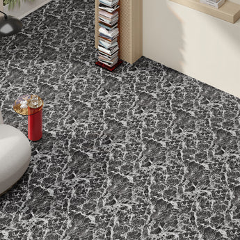 Dark gray marble-look vinyl floor tiles with white veining along room corner