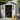 Open plastic storage shed with double doors showing interior tool storage