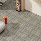 Wood-effect vinyl floor tiles in muted gray-green herringbone pattern