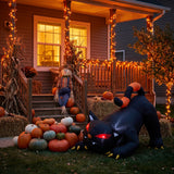 Inflatable Halloween animal decoration with glowing red eyes in outdoor yard
