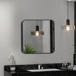 Square bathroom wall mirror with black aluminum frame and rounded corners, light reflections