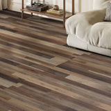 Wood-grain PVC floor planks on self-adhesive tiles, brown and tan staggered layout