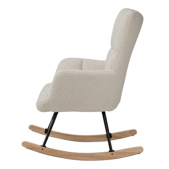 Side view of sherpa upholstered rocking chair with tufted back, black frame and light wood base