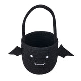 Black Halloween treat bucket bag with top handle and smiling ghost face