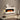 White electric fireplace mantel with bright flame display and log/coal effect