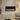 Wall-mounted electric fireplace with black frame and orange flame display