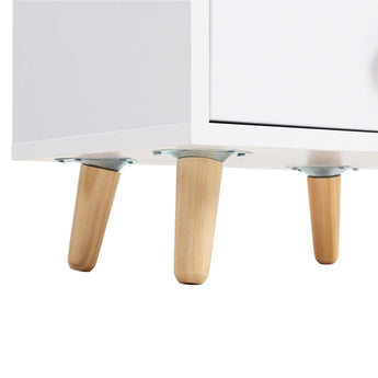 White wooden bedside table underside view with light wood legs and metal supports