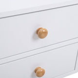 White wooden bedside table drawer fronts with round wooden knobs