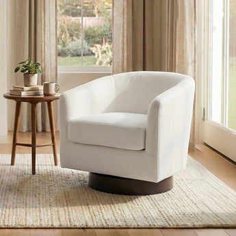 Cream accent swivel armchair with rounded backrest, padded arms, and dark base.