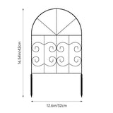 Black arched metal garden border fence panel with scrollwork and two pointed stakes