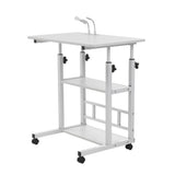 White overbed laptop table with two shelves and caster wheels, adjustable legs