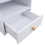 Open drawer of white bedside table showing inner storage space