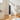 White standing electric heater with dark front grille and top digital display