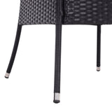 Round outdoor table with parasol hole, black woven legs with white bands.