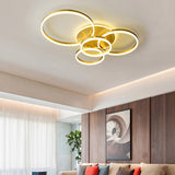 3-ring gold LED ceiling light with circular loop frames and white inner glow