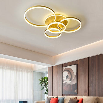 3-ring gold LED ceiling light with circular loop frames and white inner glow
