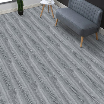 Grey rustic woodgrain PVC flooring planks with visible plank seams
