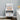White wooden bedside table with 1 drawer, open shelves, rounded feet
