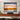 Electric projector screen with rolled housing and motor cable, showing a wide picture