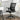 Black mesh back ergonomic office chair with folding armrests and swivel casters