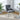 Luxury dining chair with gray upholstered seat and back, button-tufted, metal legs