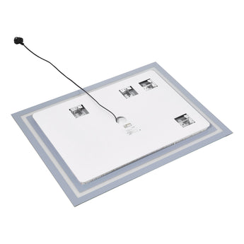 Wall-mounted LED bathroom mirror showing back connectors and control icons on glass