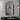 Arched wall mirror with black aluminium frame, wall-mounted with light reflections