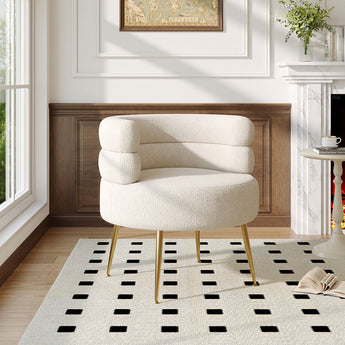 Cream teddy accent chair with curved arms and tufted back, gold tapered legs