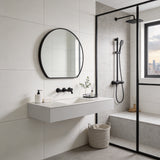 Wall-mounted arched bathroom mirror with dark frame and reflective glass panel