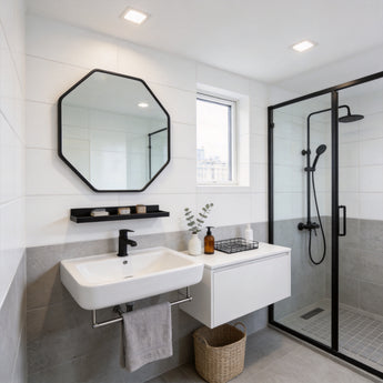 Black octagonal bathroom mirror with aluminium frame and built-in towel shelf