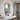 Wall-mounted oval bathroom mirror with black aluminium frame and towel shelf