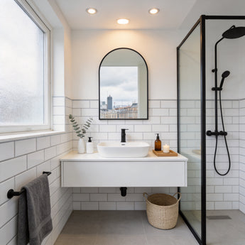 Wall-mounted bathroom mirror with black alloy frame, arched top