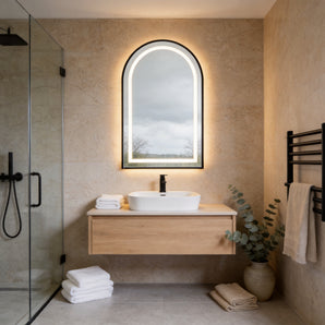 Arched LED bathroom mirror with lit anti-fog frame and touch dimmable light.
