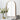 Arch-shaped wall mirror with gold metal frame and clear reflective surface