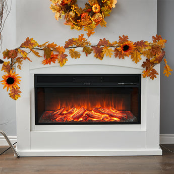 Autumn leaf garland with orange foliage and black-centered blooms draped over fireplace