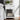 White nightstand with one drawer and open bottom shelf for storage