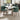 Modern set of 2 upholstered dining chairs in green, curved back and padded seat