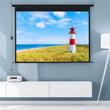 Electric projector screen displaying a lighthouse scene with blue sky and green dunes
