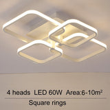 LED ceiling fixture with four square rings and adjustable light heads, white housing