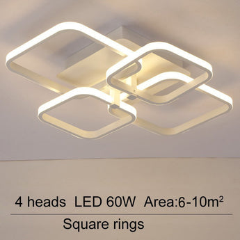 LED ceiling fixture with four square rings and adjustable light heads, white housing