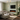 Black electric fireplace insert installed in a modern living room with LED flame display