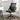 Black upholstery office chair with mesh back, folding arms, and 360-degree swivel base