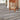Gray wood-grain peel-and-stick vinyl floor planks, shown installed