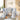 Toddler playset with two slides and basketball hoop, white and light blue panels